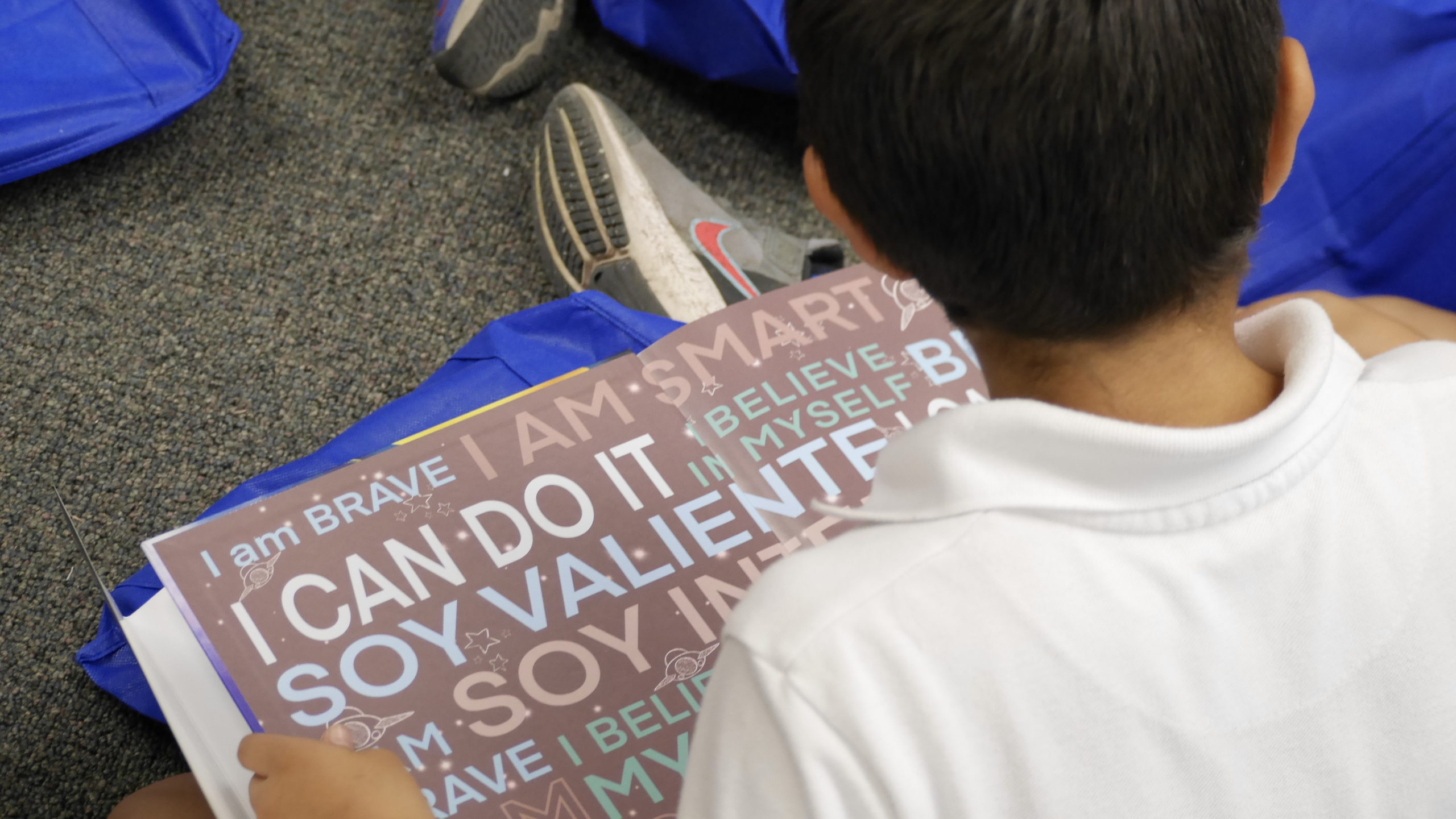 Photo of child reading book